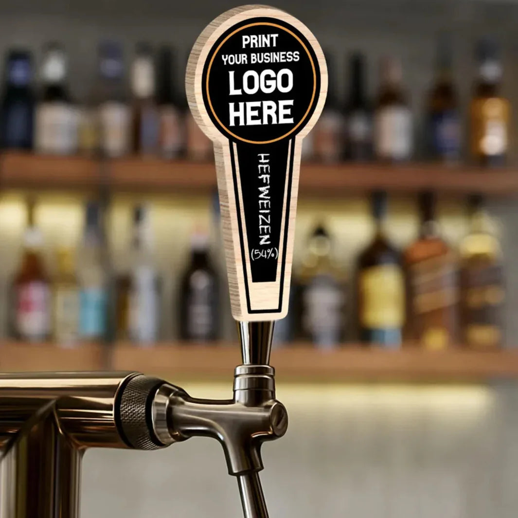Custom beer tap handle with business logo space in bar setting, labeled hefeweizen.