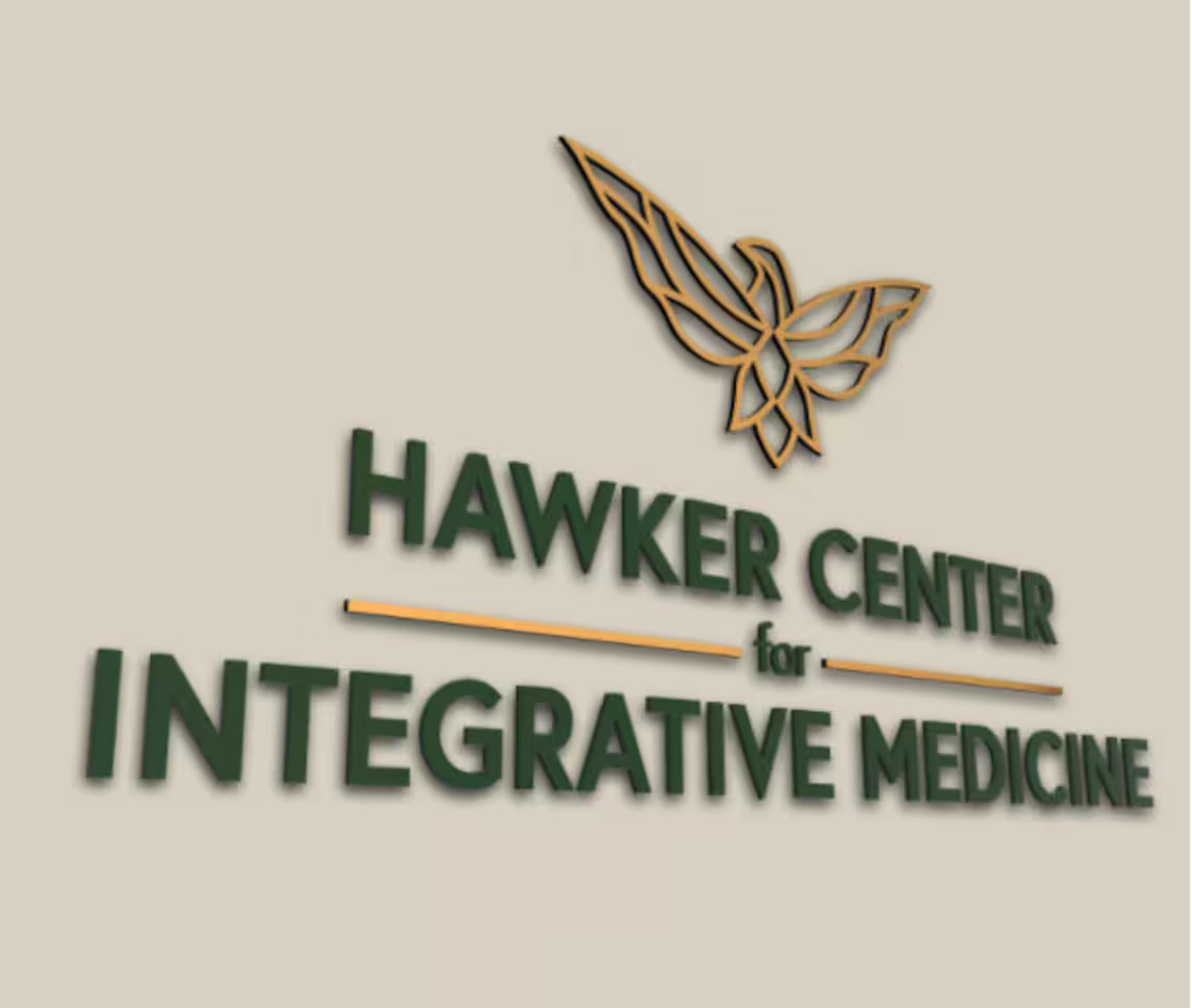 Business signage for Hawker Center for Integrative Medicine with stylized hawk logo