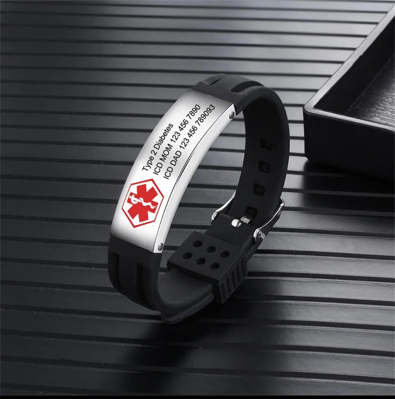 Black medical alert ID bracelet with Type 2 Diabetes engraving on a ribbed black surface