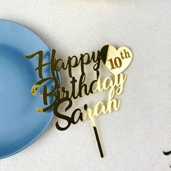 Gold Happy 10th Birthday Sarah cake topper with heart on a white table beside blue plate