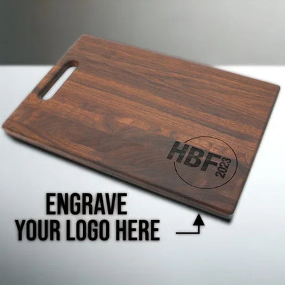 Custom walnut cutting board with logo engraving option on light surface