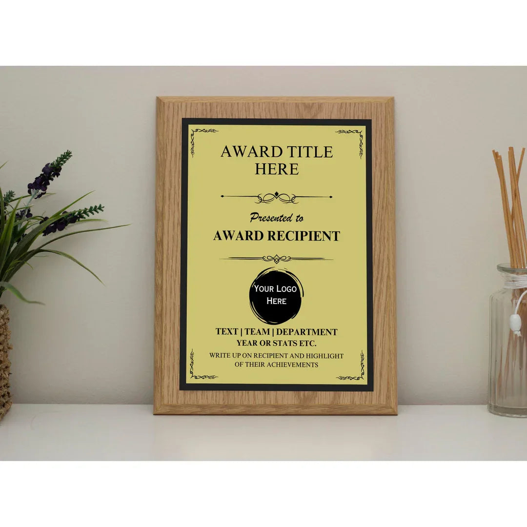 Custom award plaque with text fields and logo, displayed on desk with plant decor