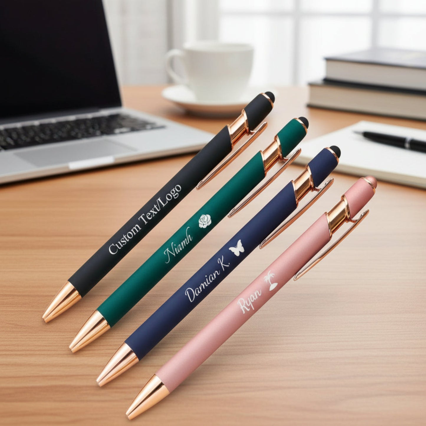 Five personalized pens with different designs and text on a light background