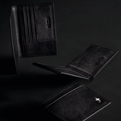 Black leather wallets on a dark background