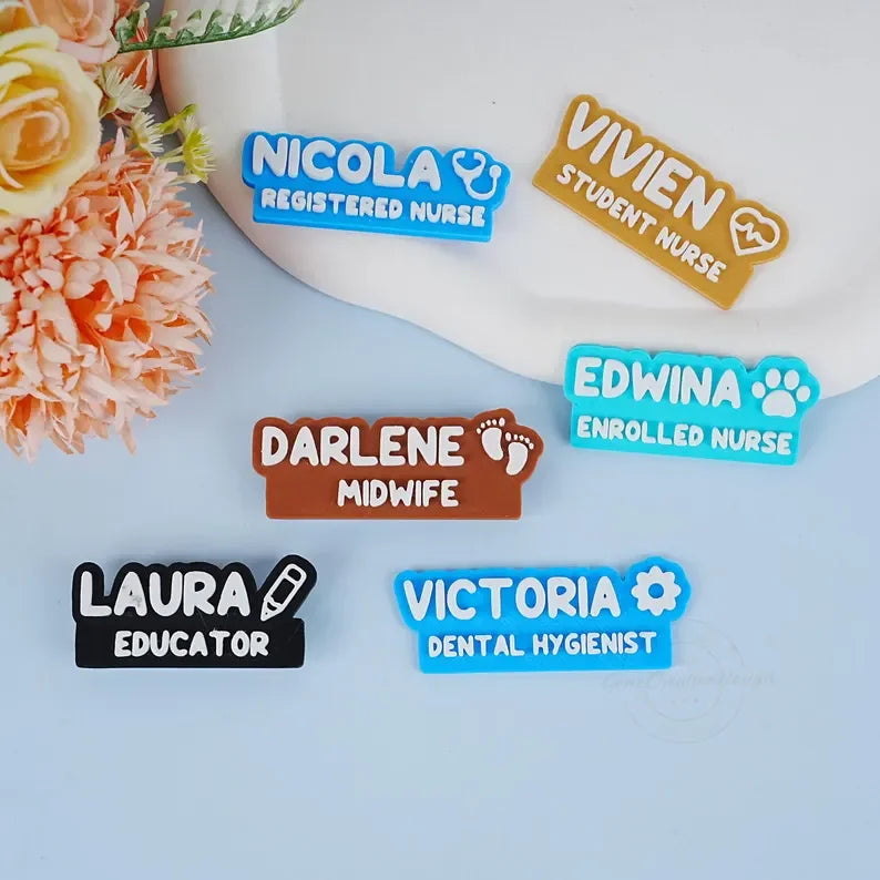Colorful custom nurse and educator name badges with floral decor on a light background